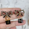 全館特價!!皮穿鍊蝴蝶結 黑色鎖頭